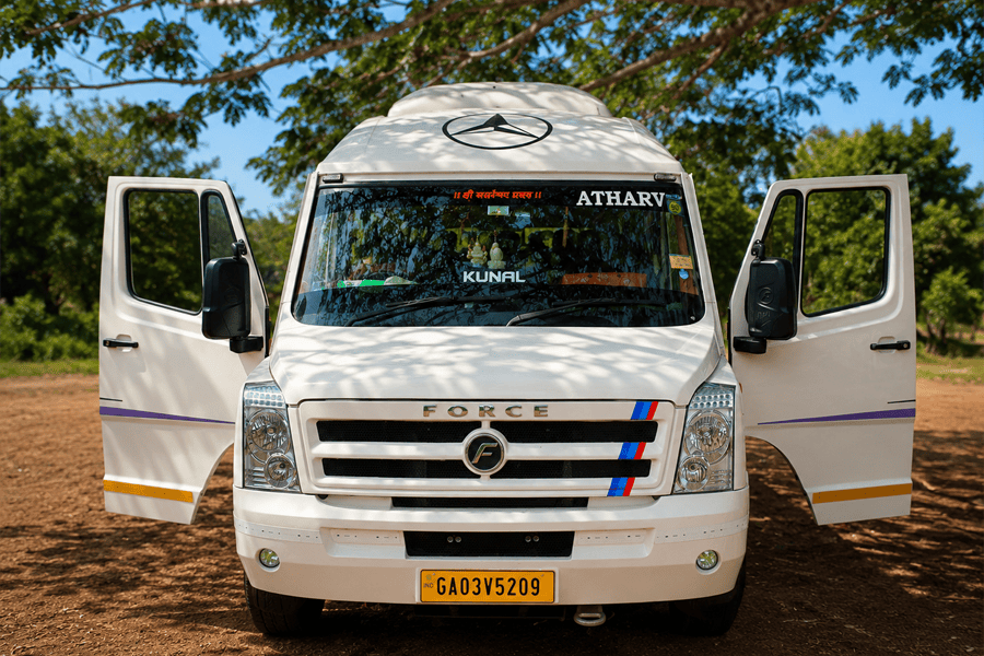 White AC Tempo Traveller minibus ready for a Goa tour